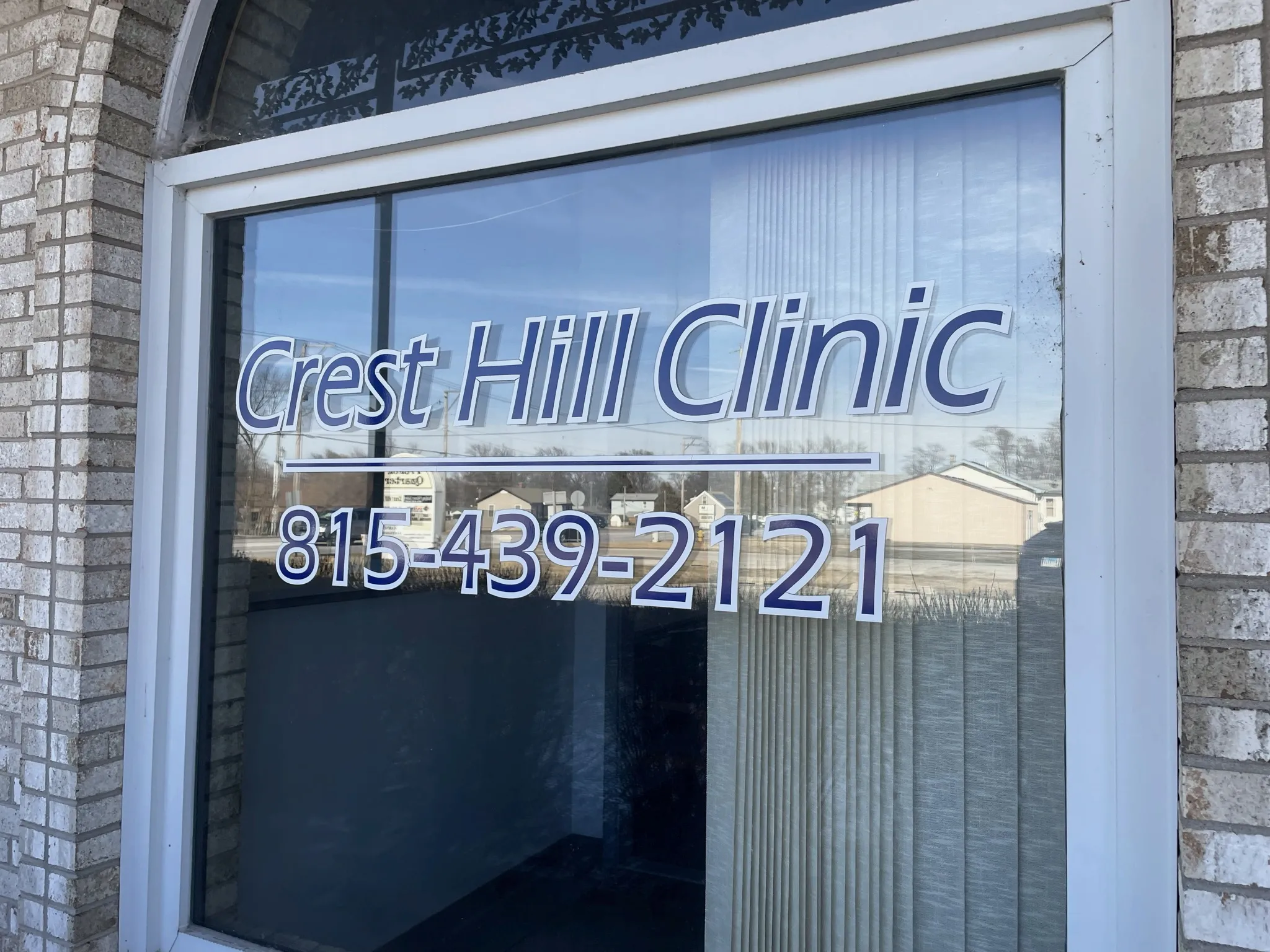 Crest Hill Clinic storefront window signage at 2430 Plainfield Rd