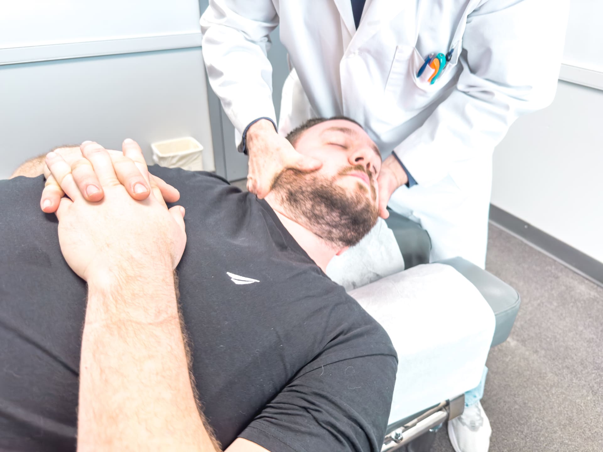 Patient receiving a chiropractic neck adjustment at Crest Hill Clinic near Joliet