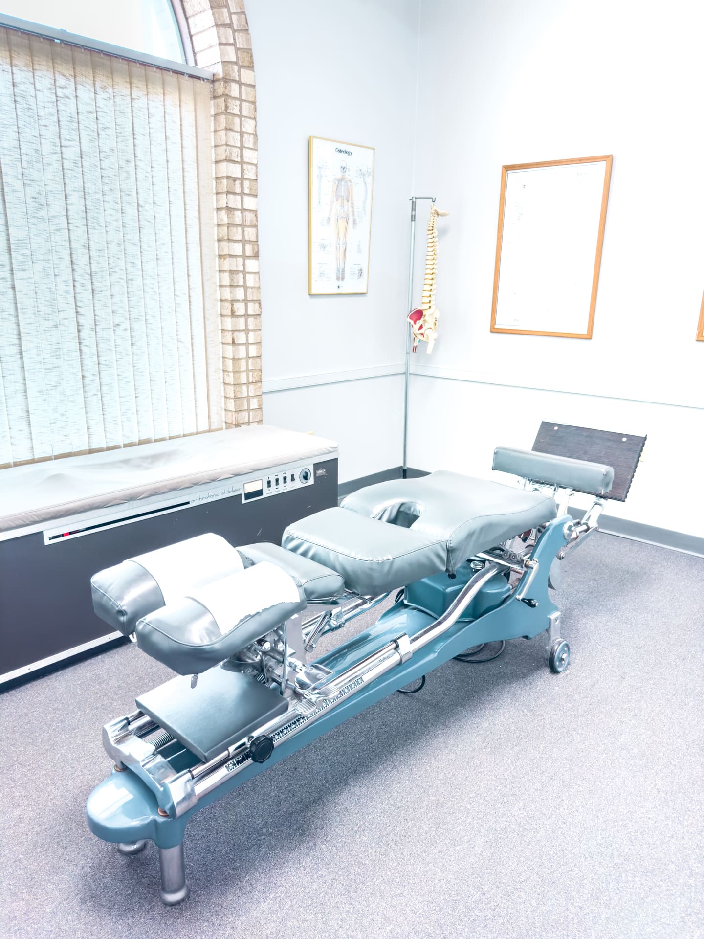 Chiropractic treatment room and adjustment table at Crest Hill Clinic near Joliet